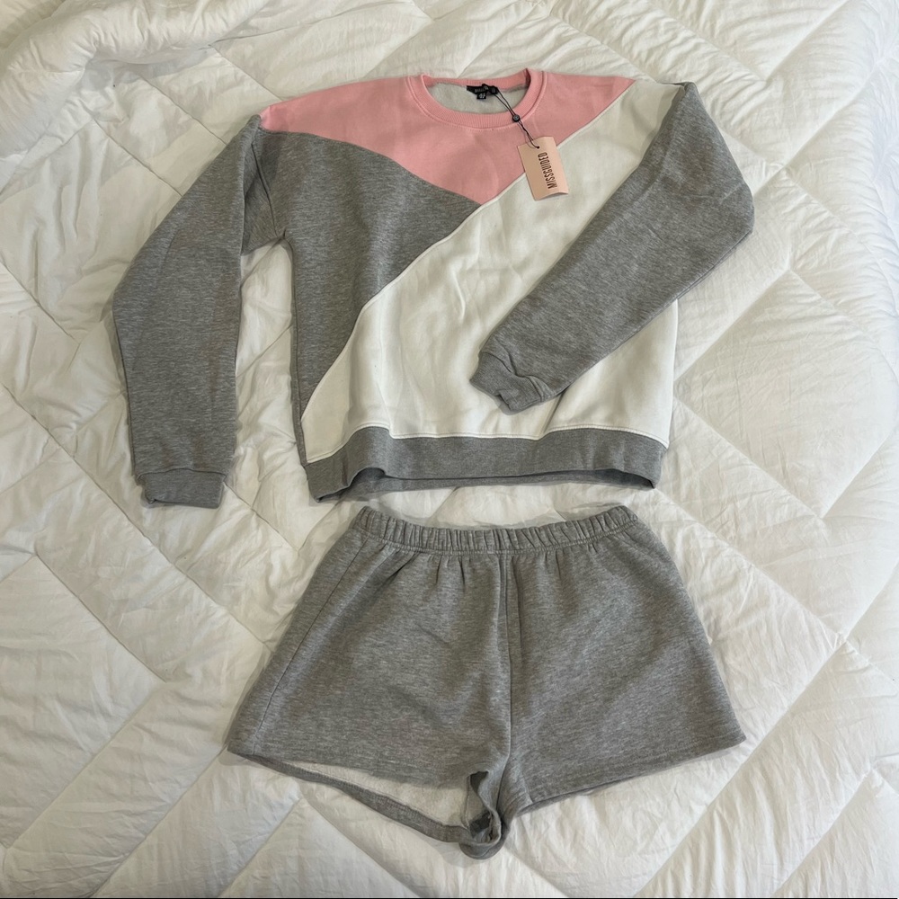 NEW with tags - 2 piece shorts and crew neck set (size 8)